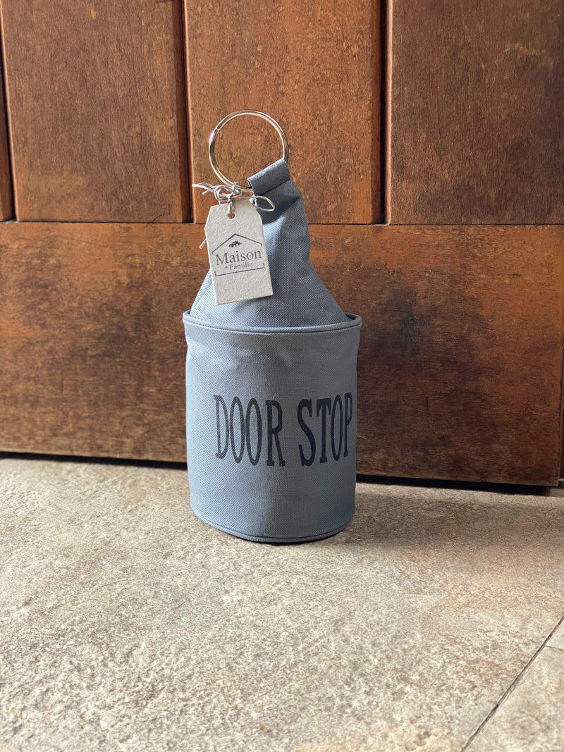 Tope de puerta con anillo metálico Gris