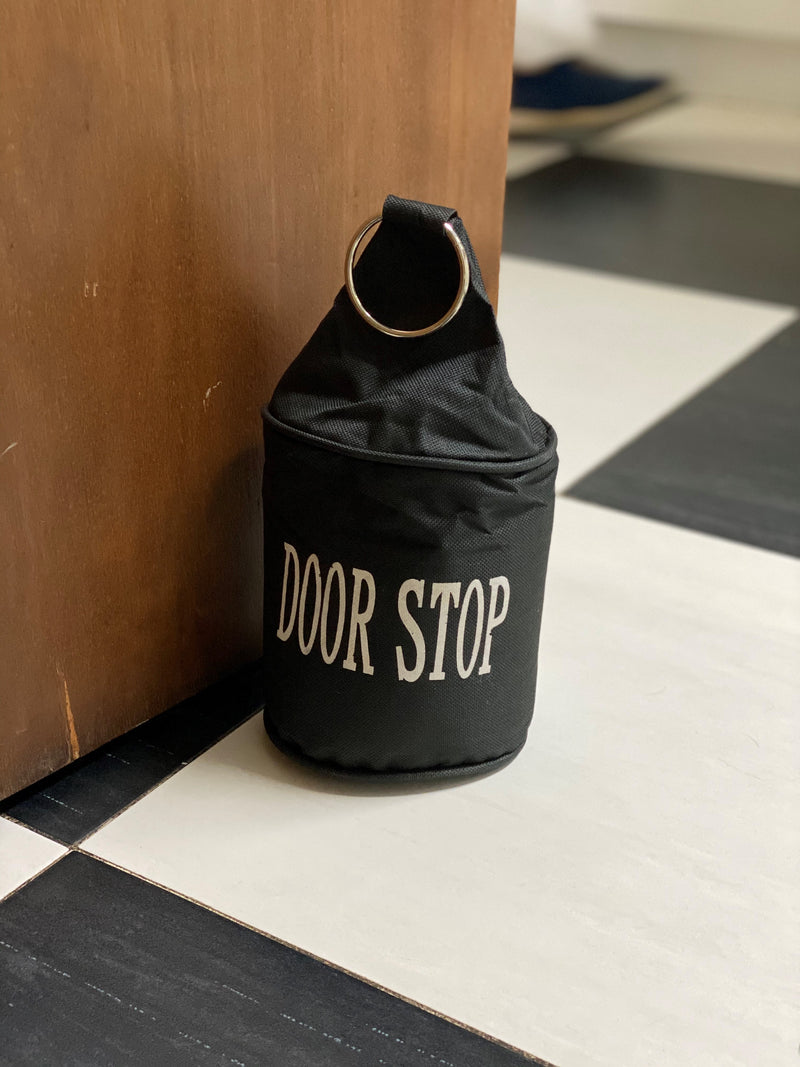 Tope de puerta con anillo metálico Negro